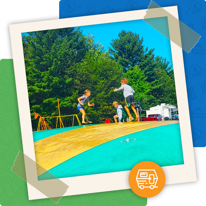 Kids at family friendly Pineland Camping park in Big Flats WI bounce on jumping pillow