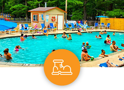 Heated outdoor pool at Pineland Camping park campground in Big Flats Wisconsin