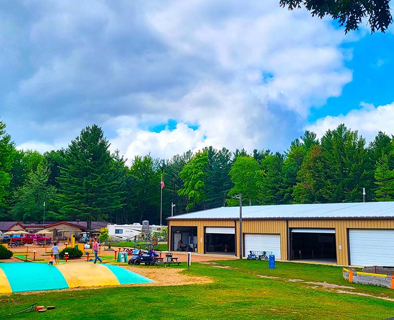 Scenic view of bounce pillow and kids clubhouse at Pineland Camping Park