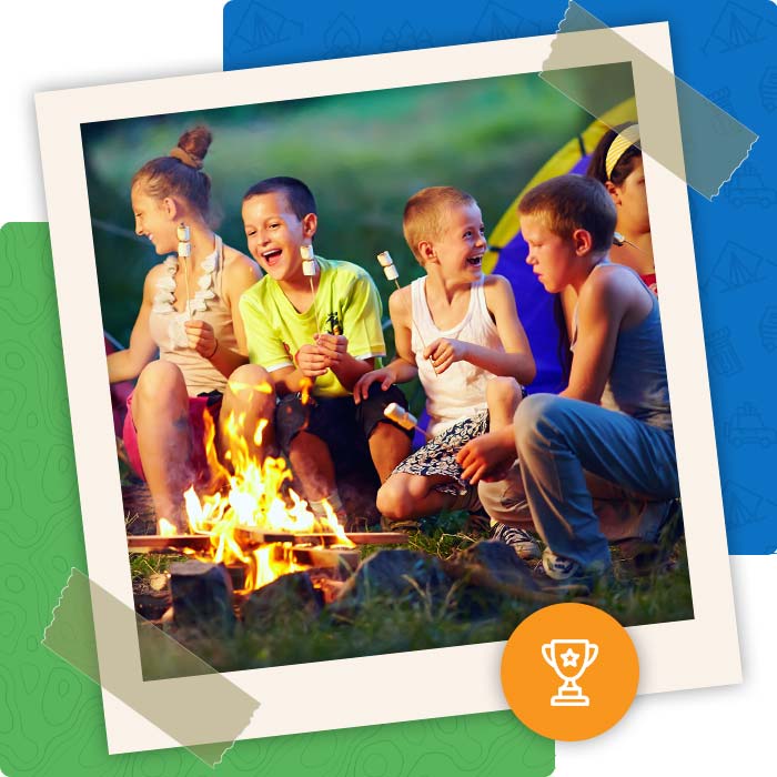 Group of kids and campers roast marshmallows at Pineland Camping Park, recently ranked by USA Today as the top 8 campgrounds in the U.S.